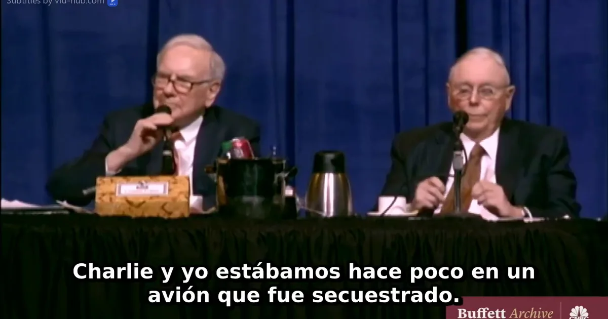 A frame of a real Vid Hub result: two men at a panel table, with Spanish subtitles burned in at the bottom of the picture.
